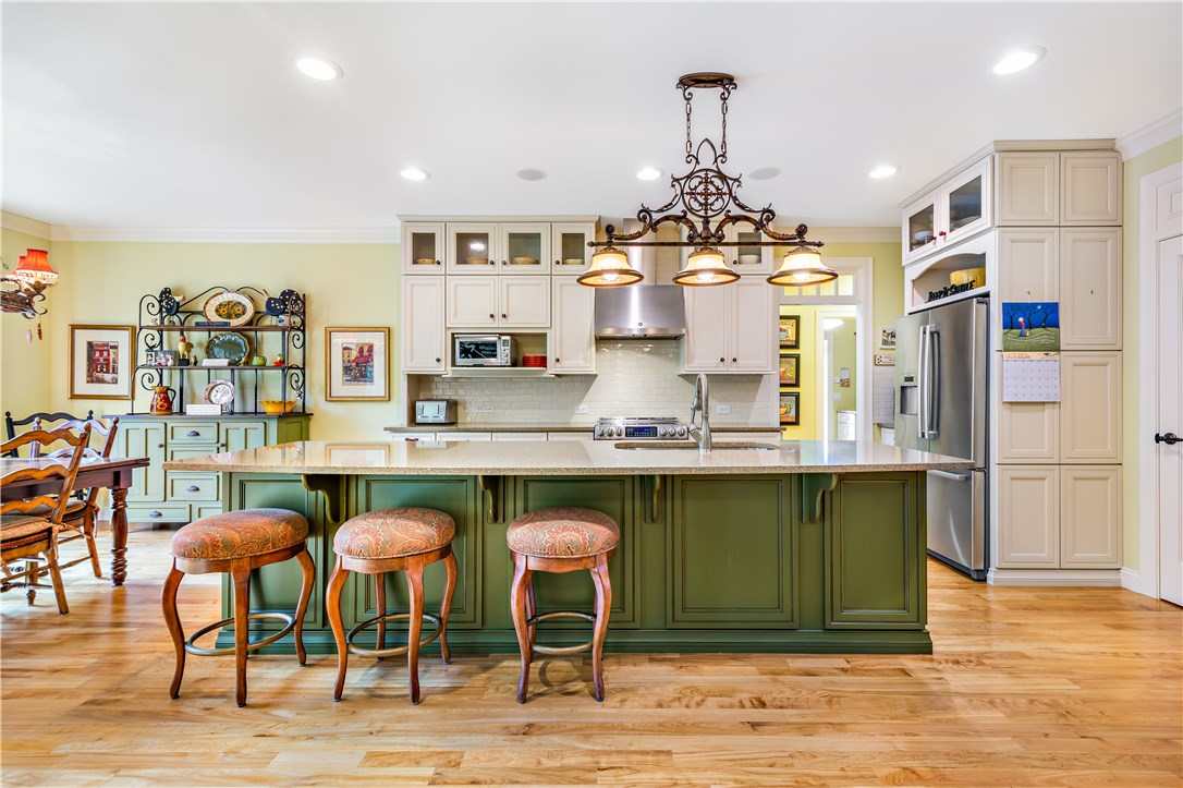 52 Kayla Ricci Way Exeter, RI 02874 - Photo 13 of 40 Two-tone cabinets are striking and island allows seating for five.