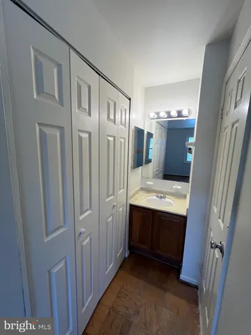 a bathroom with a double vanity sink and mirror