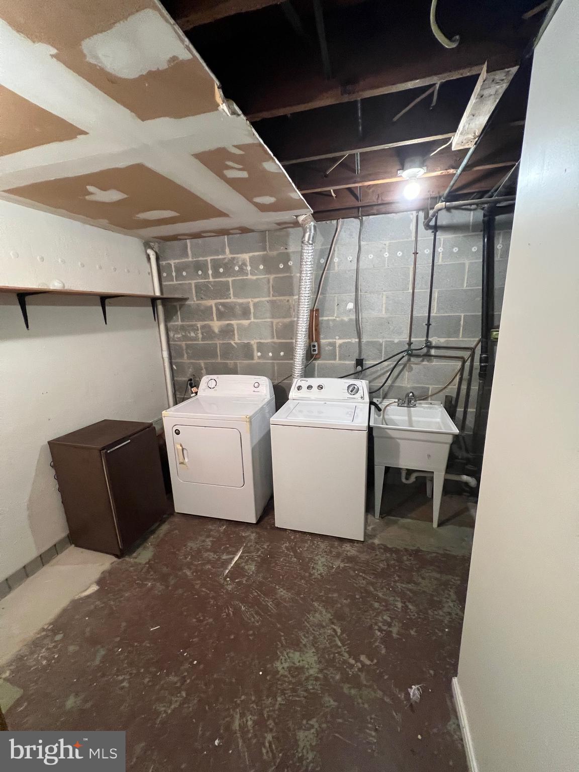 5805 Morningbird Lane Columbia, MD 21045 - Photo 24 of 26 a utility room with dryer and washer