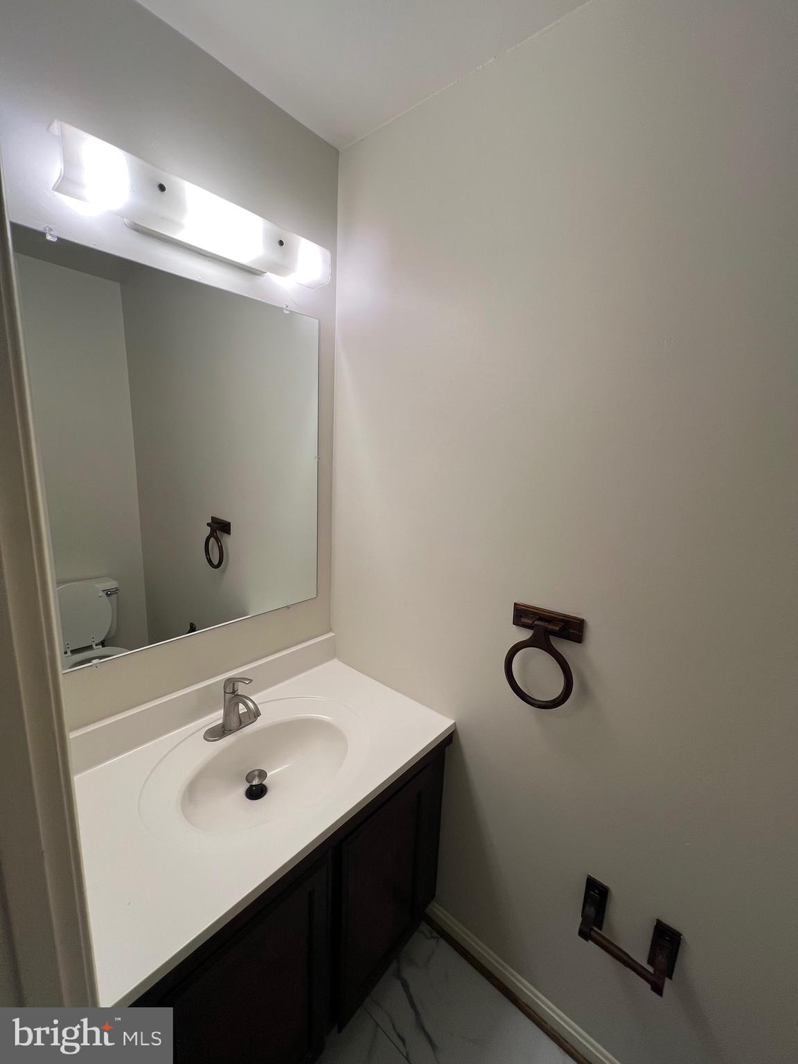 5805 Morningbird Lane Columbia, MD 21045 - Photo 10 of 26 a bathroom with a sink and a mirror