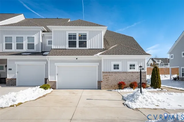 a front view of a house with a garage
