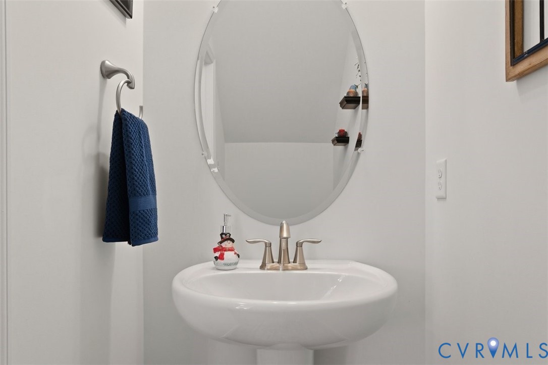12813 Deep Wl Road Midlothian, VA 23112 - Photo 13 of 35 a bathroom with a sink and mirror
