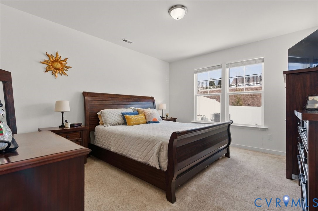 12813 Deep Wl Road Midlothian, VA 23112 - Photo 18 of 35 a bedroom with a bed and a table in it