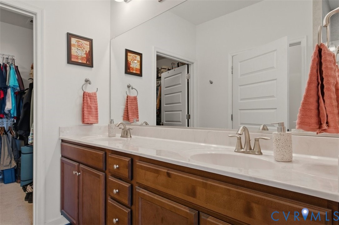 12813 Deep Wl Road Midlothian, VA 23112 - Photo 21 of 35 a bathroom with a sink and a mirror