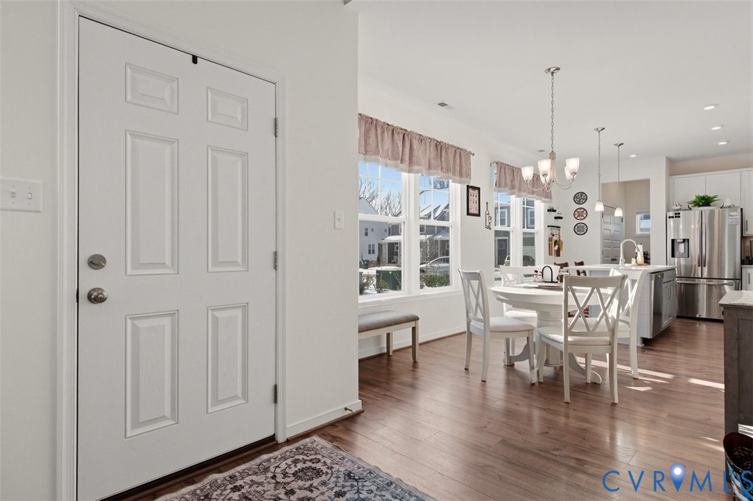 12813 Deep Wl Road Midlothian, VA 23112 - Photo 5 of 35 a dining room with furniture entryway and wooden floor