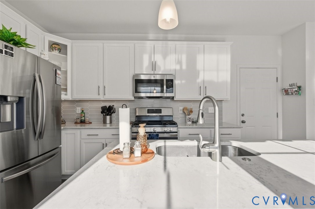 12813 Deep Wl Road Midlothian, VA 23112 - Photo 9 of 35 a kitchen with stainless steel appliances granite countertop a refrigerator a stove a sink and white cabinets