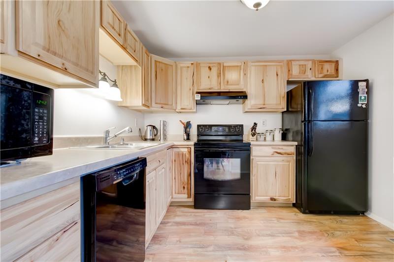 222 Quail Run Road Venetia, PA 15367 - Photo 11 of 22 Kitchen with light toned cabinets and beautiful flooring.