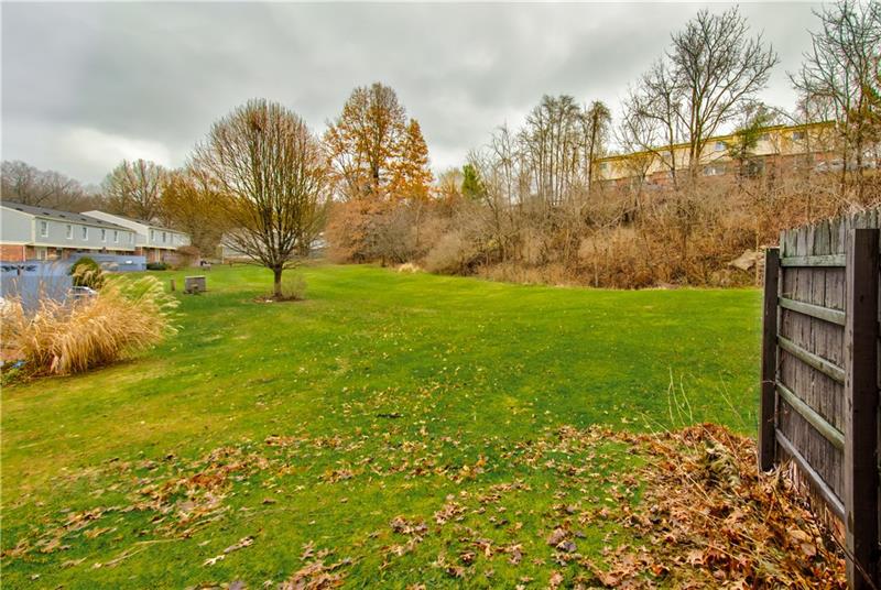 222 Quail Run Road Venetia, PA 15367 - Photo 4 of 22 View of the green space from the back patio. Enjoy watching mother nature.