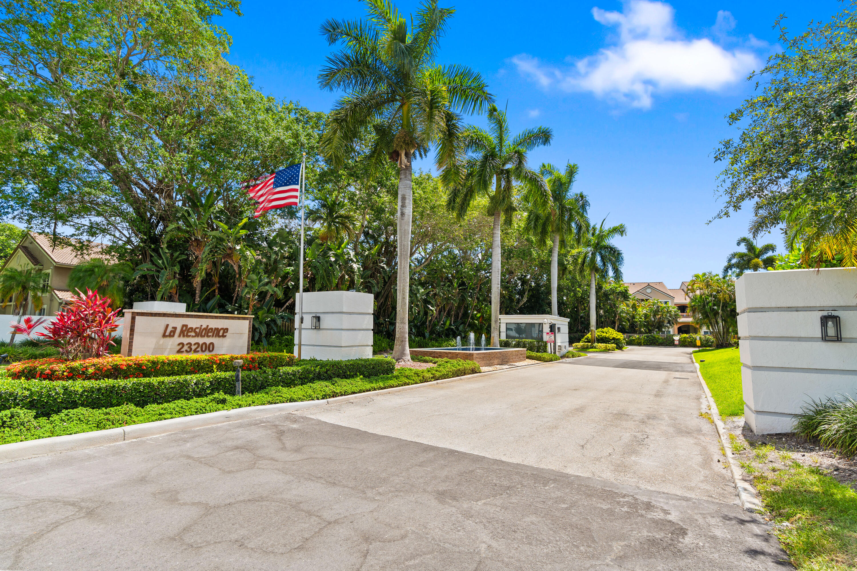 23200 Camino Del Mar, Unit 603 Boca Raton, FL 33433 - Photo 43 of 43 a view of a house with basketball court and palm trees