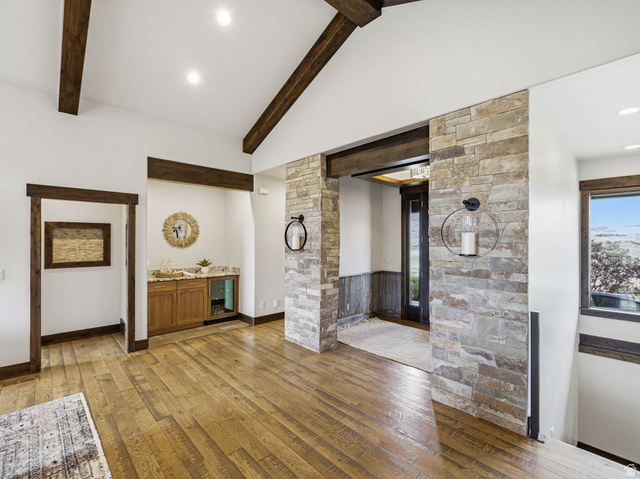 402 Shadow Hill Road Wanship, UT 84017 - Photo 21 of 90 Unfurnished living room with light wood finished floors, recessed lighting, and vaulted ceiling