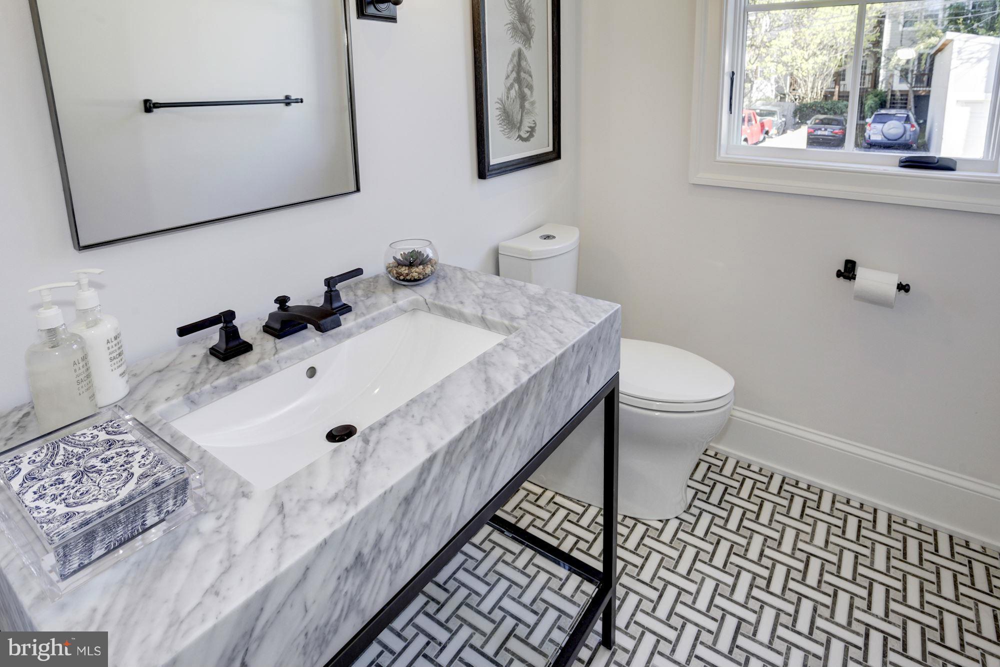 3713 Reservoir Road Northwest Washington, DC 20007 - Photo 13 of 30 a bathroom with a sink toilet and mirror