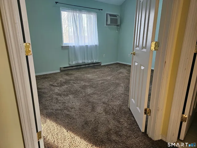 a view of a bathroom with a sink and a window