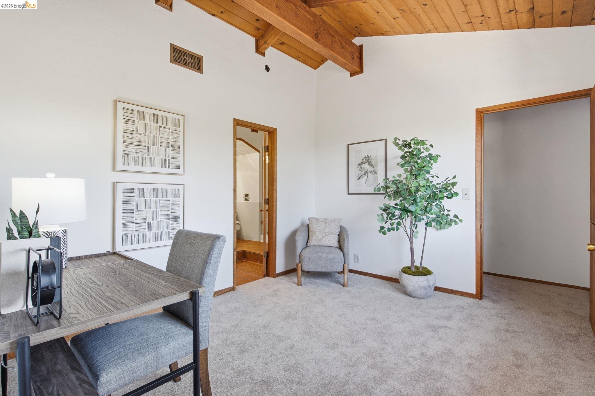 4522 Santa Rita Road El Sobrante, CA 94803 - Photo 34 of 58 Vaulted wood-paneled ceiling, exposed wood beams, and neutral carpeting