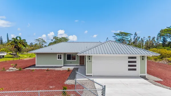 a front view of a house with a garage