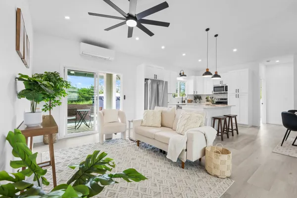 a living room with furniture and a large window