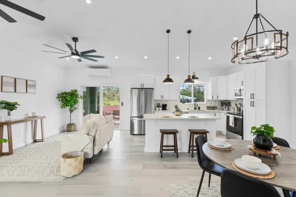 a view of living room and kitchen with furniture
