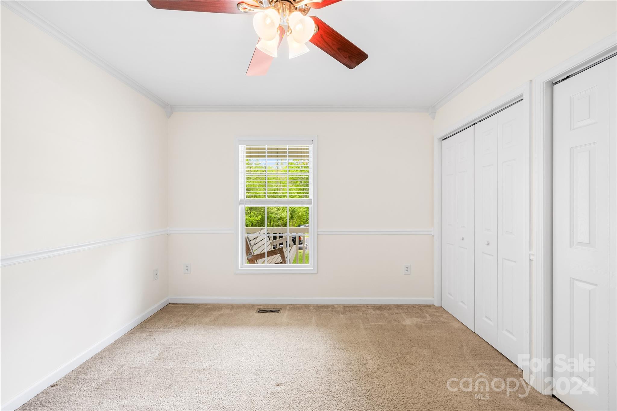 220 Shenandoah Loop Troutman, NC 28166 - Photo 19 of 26 an empty room with a window and a fan