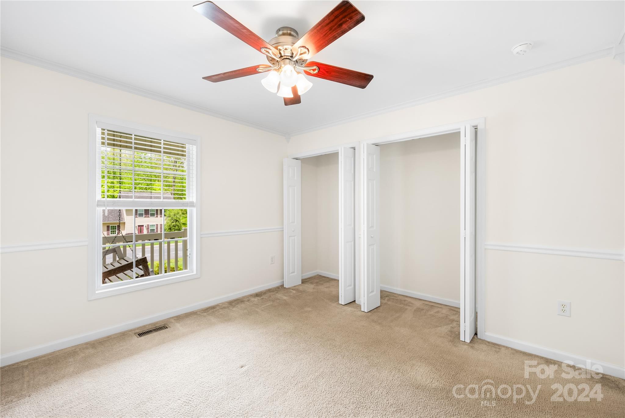 220 Shenandoah Loop Troutman, NC 28166 - Photo 20 of 26 an empty room with windows and fan