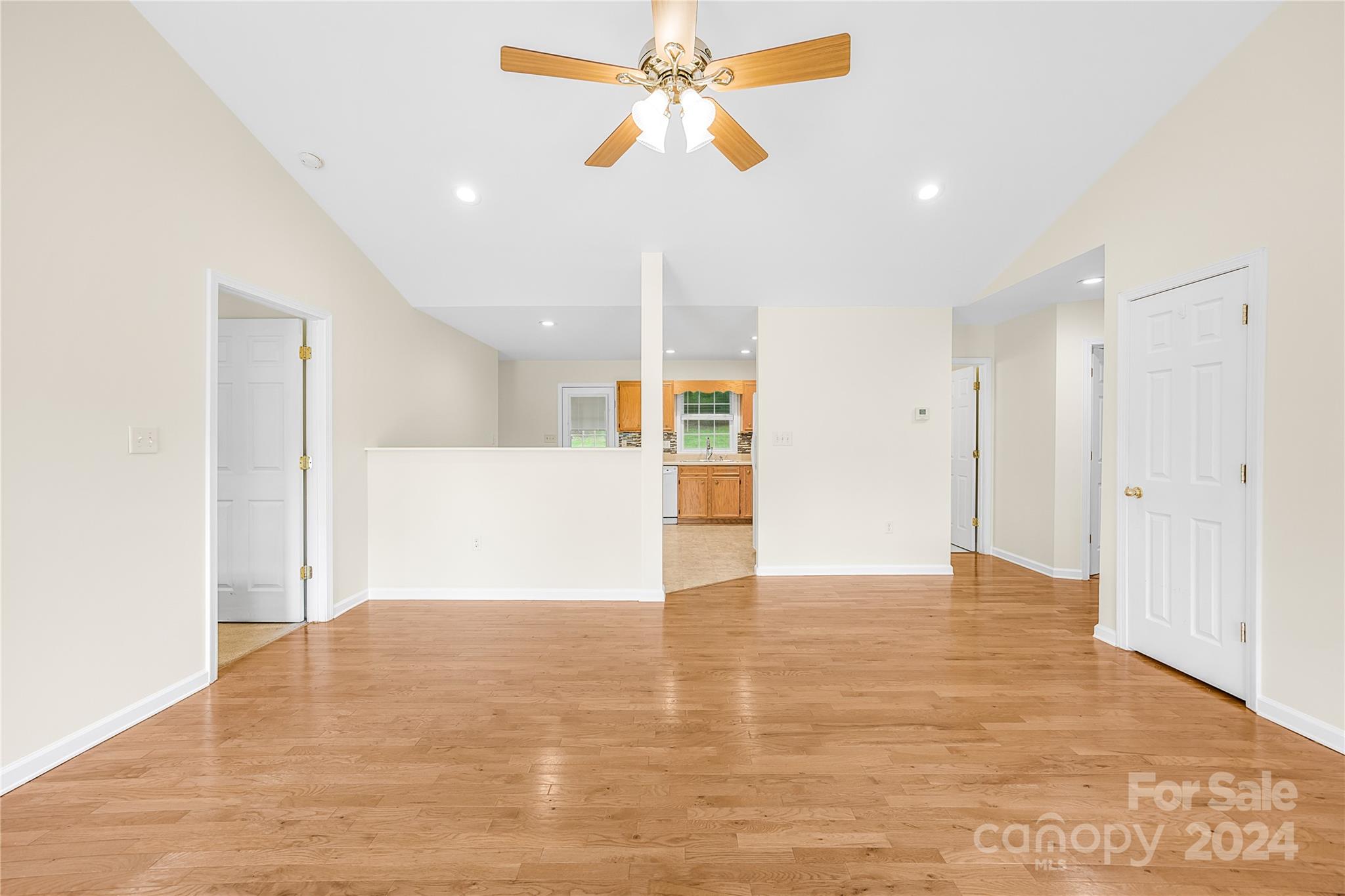 220 Shenandoah Loop Troutman, NC 28166 - Photo 10 of 26 a view of an empty room and chandelier fan