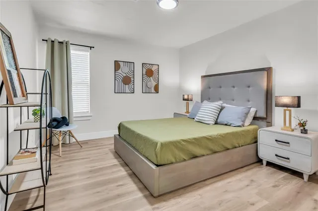 a bedroom with a bed and a table