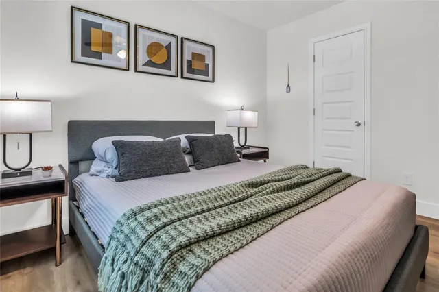 a bedroom with a bed and lamp