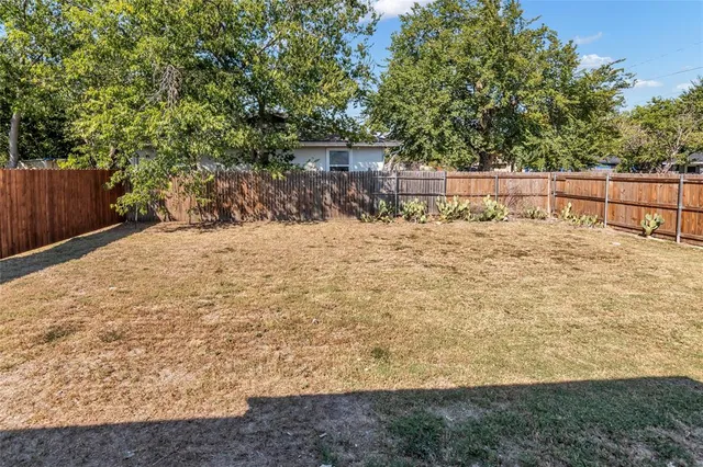 a view of a backyard of a house