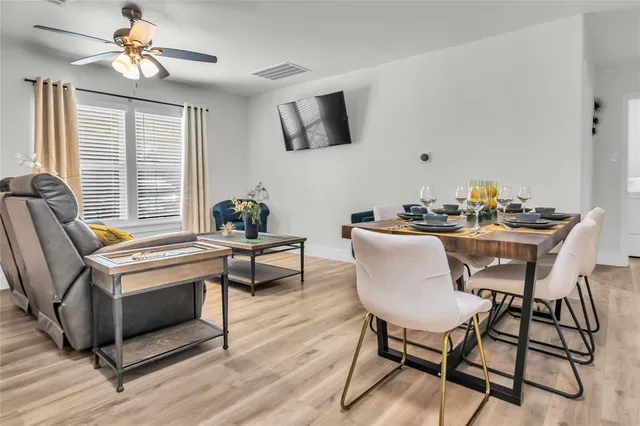 a dining room with furniture and window