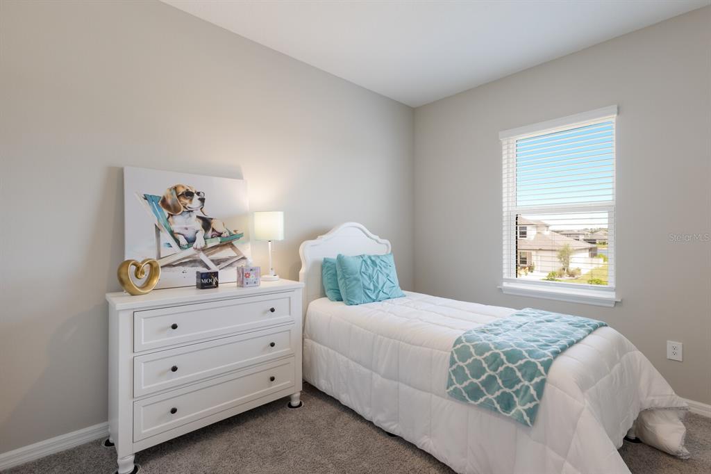 9312 Tequila Sunrise Drive Sarasota, FL 34241 - Photo 26 of 78 a bedroom with a bed and window