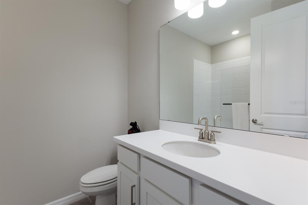 9312 Tequila Sunrise Drive Sarasota, FL 34241 - Photo 27 of 78 a bathroom with a sink toilet and a mirror