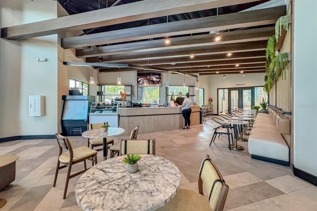 9312 Tequila Sunrise Drive Sarasota, FL 34241 - Photo 45 of 78 a living room with furniture and a table