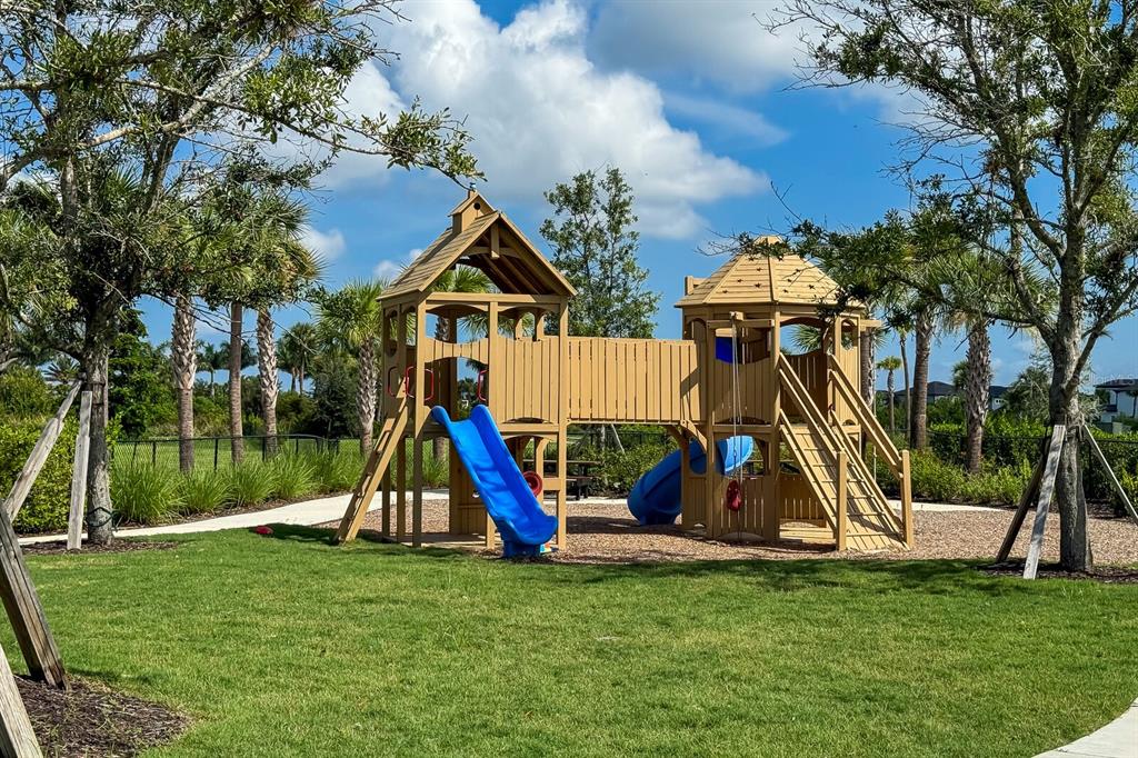 9312 Tequila Sunrise Drive Sarasota, FL 34241 - Photo 70 of 78 a view of a park with a slide