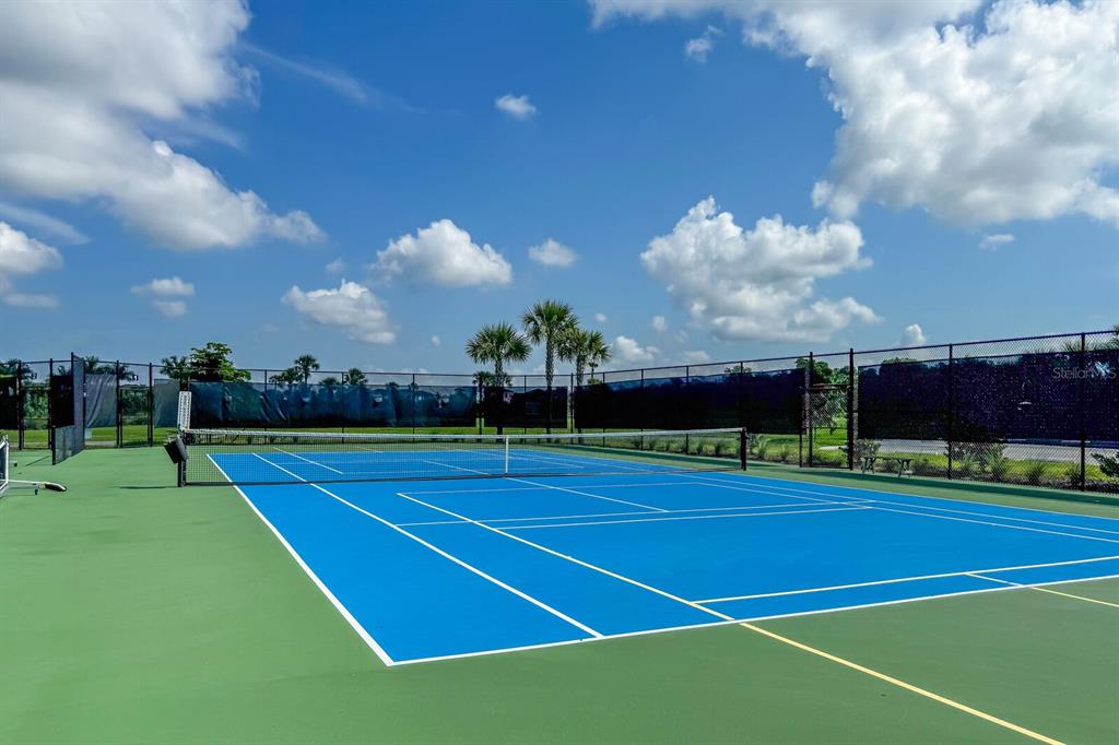9312 Tequila Sunrise Drive Sarasota, FL 34241 - Photo 72 of 78 a view of an outdoor space and tennis court