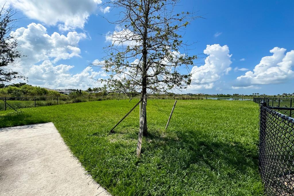 9312 Tequila Sunrise Drive Sarasota, FL 34241 - Photo 77 of 78 a view of a golf course with a fountain