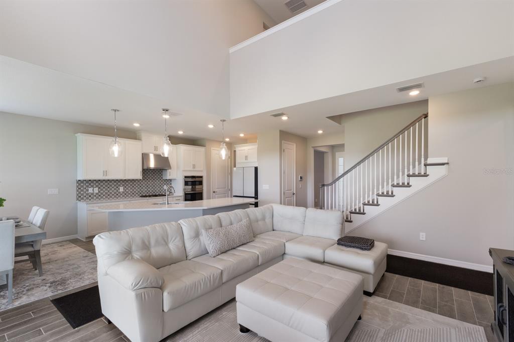 9312 Tequila Sunrise Drive Sarasota, FL 34241 - Photo 9 of 78 a living room with furniture and a view of kitchen
