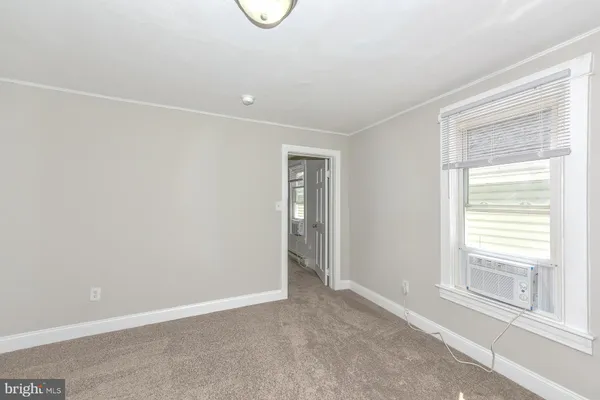 a view of an empty room with a window