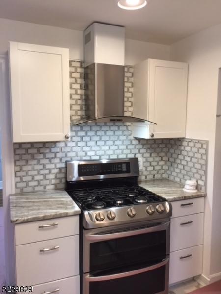 759 Ridgewood Road Millburn, NJ 07041 - Photo 12 of 36 a kitchen with a stove and a microwave