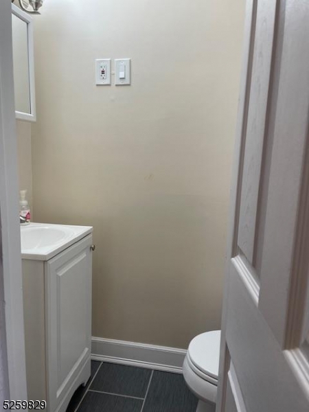 759 Ridgewood Road Millburn, NJ 07041 - Photo 15 of 36 a bathroom with a toilet and a sink