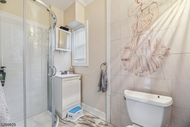 759 Ridgewood Road Millburn, NJ 07041 - Photo 17 of 36 a bathroom with a toilet and a shower