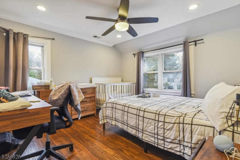759 Ridgewood Road Millburn, NJ 07041 - Photo 18 of 36 a bedroom that has a bed and wooden floor