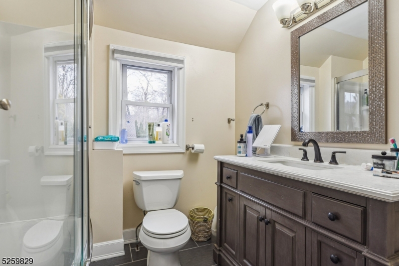 759 Ridgewood Road Millburn, NJ 07041 - Photo 19 of 36 a bathroom with a toilet sink and mirror