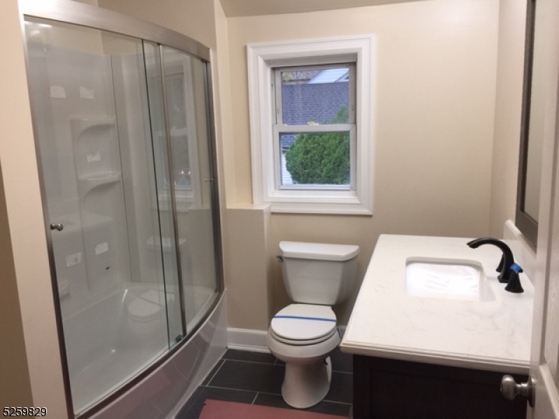 759 Ridgewood Road Millburn, NJ 07041 - Photo 20 of 36 a white toilet sitting next to a bathroom sink