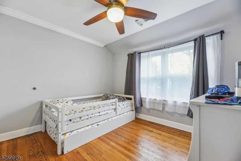 759 Ridgewood Road Millburn, NJ 07041 - Photo 21 of 36 a bedroom with a bed and window