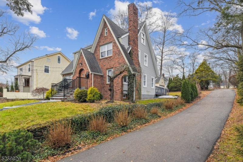 759 Ridgewood Road Millburn, NJ 07041 - Photo 26 of 36 a front view of a house with a yard