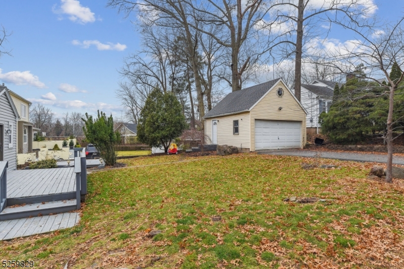 759 Ridgewood Road Millburn, NJ 07041 - Photo 27 of 36 a front view of a house with garden