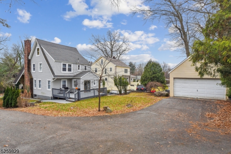 759 Ridgewood Road Millburn, NJ 07041 - Photo 28 of 36 a view of a house with swimming pool and a yard