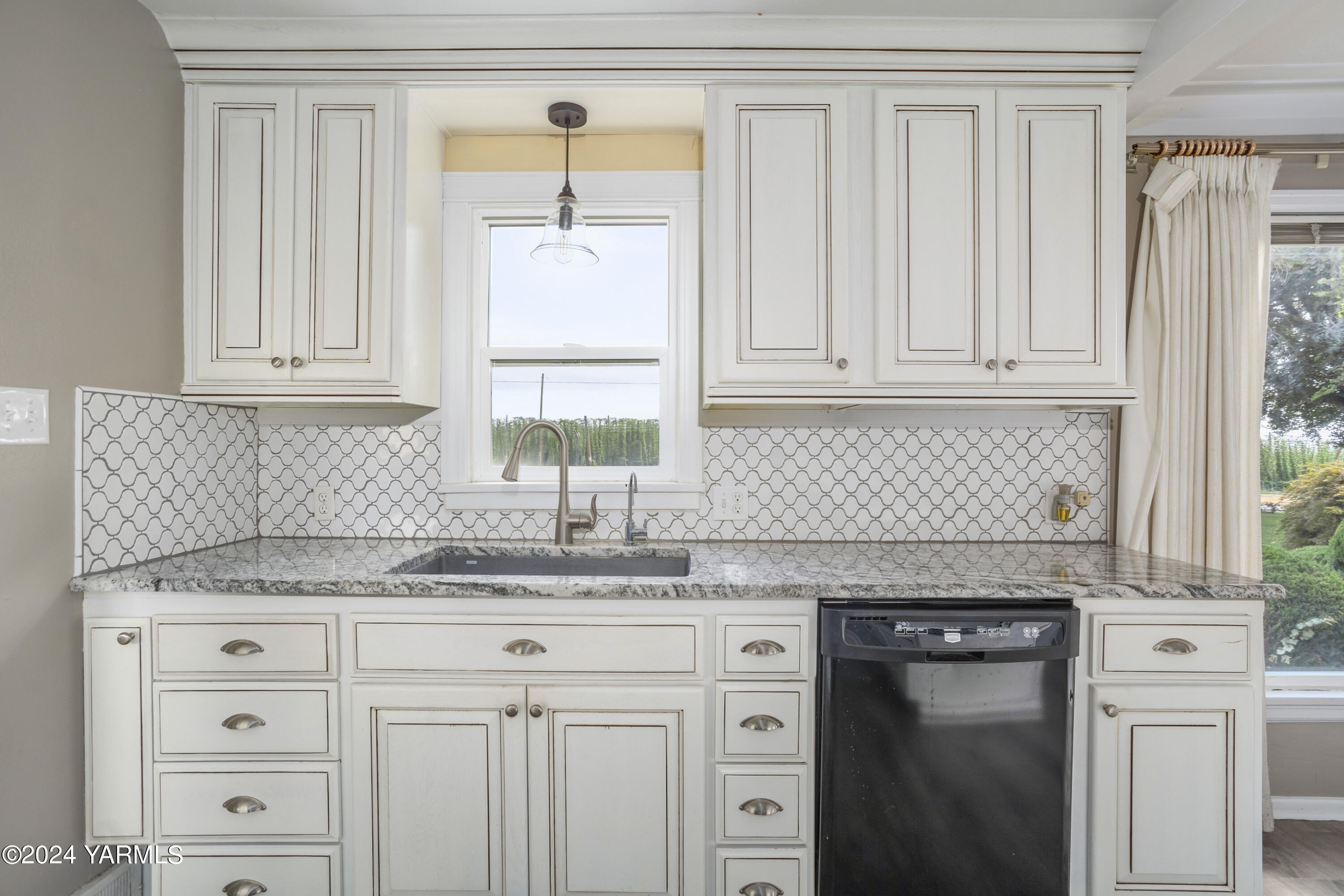 149402 McCreadie Road Prosser, WA 99350 - Photo 11 of 58 a kitchen with granite countertop white cabinets and a sink