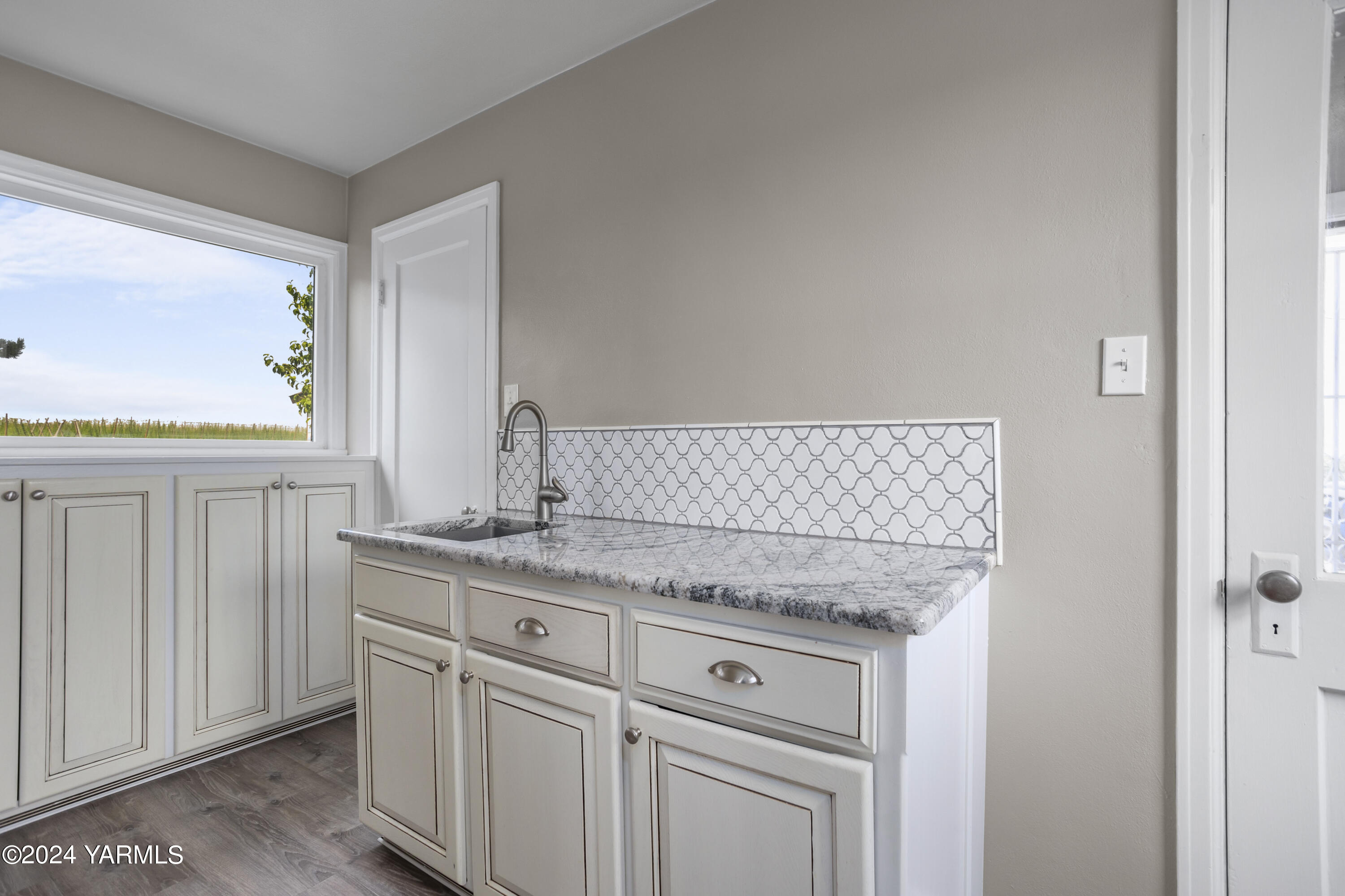 149402 McCreadie Road Prosser, WA 99350 - Photo 13 of 58 a utility room with granite countertop cabinets washer and dryer