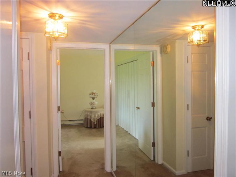 2365 Covington Road, Unit 122E Akron, OH 44313 - Photo 13 of 23 hallway with glass doors