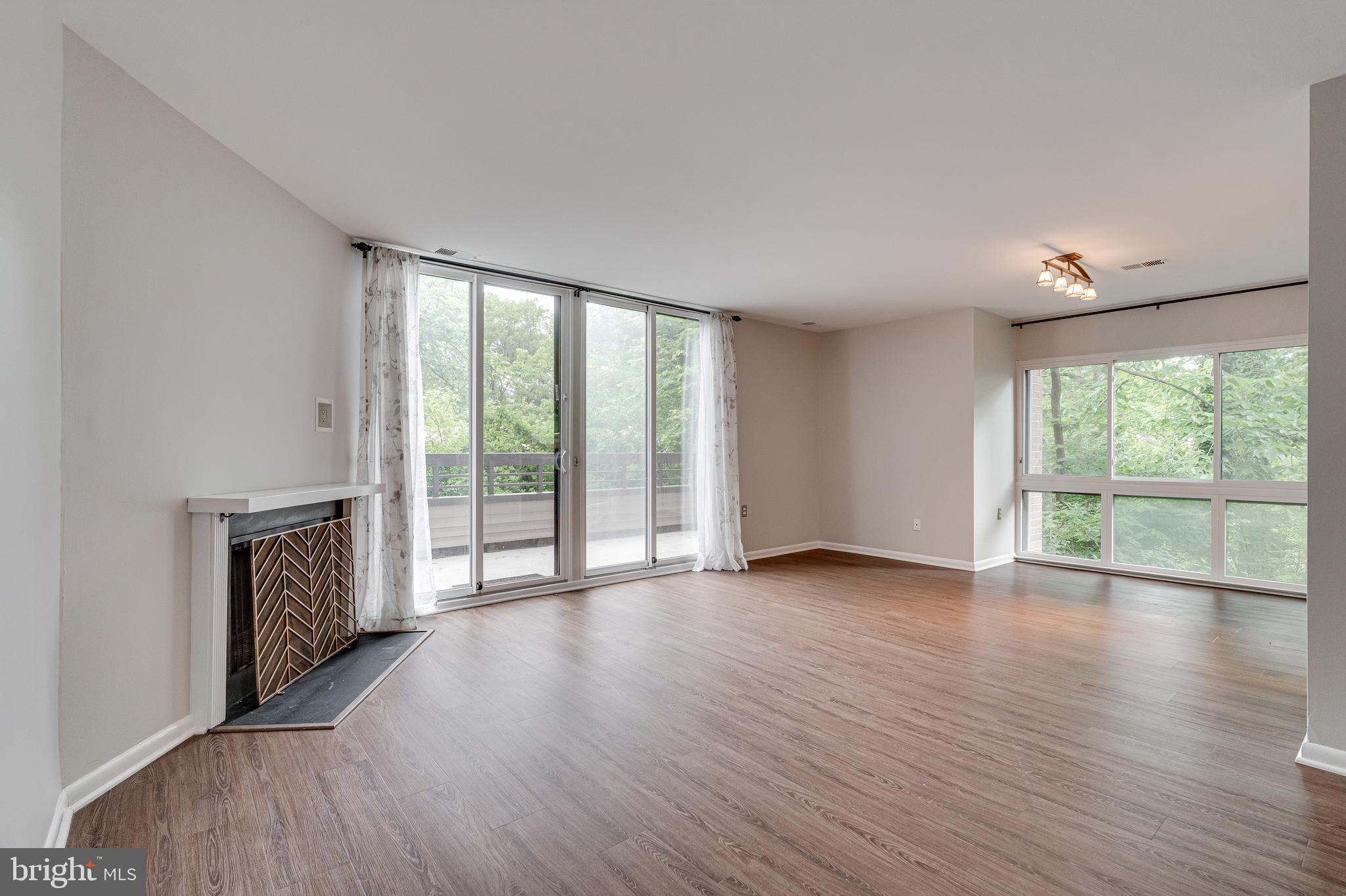11608 Windbluff Court, Unit 7/007B2 Reston, VA 20191 - Photo 7 of 47 Living room with fireplace