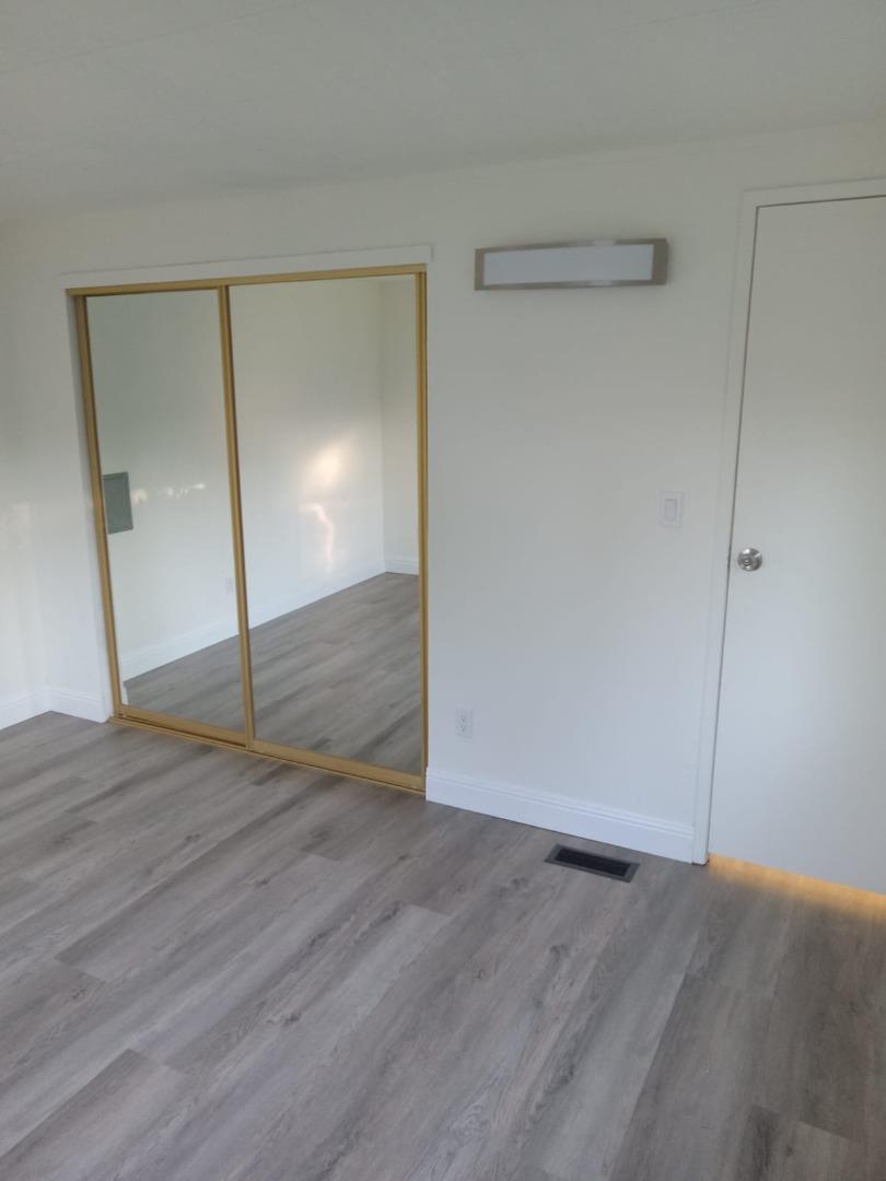 44 The Trees Drive, Unit 44 Concord, CA 94518 - Photo 12 of 22 a view of empty room with wooden floor